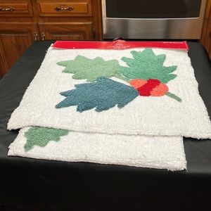 NWT Set of Two Holiday Bath Mats.  One is White With Holly Berry, the Other Joy.